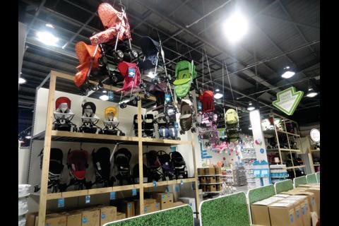 Rows of pushchairs suspended from the ceiling make for an impressive piece of visual merchandising